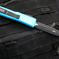 Microtech UTX-85 OTF Knife- Double Edge- Turquoise Handle- Black Plain Edge Blade 232-1 TQ