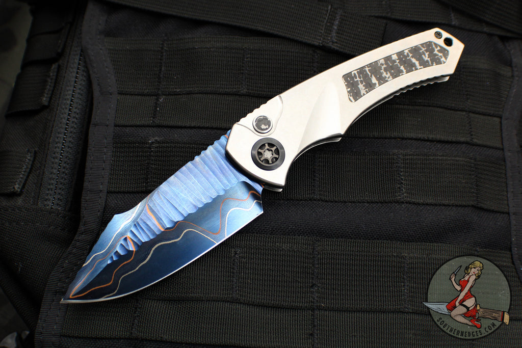 Heretic Knives Custom Pariah- OTS Auto- Titanium Frame- Fat Carbon Snakeskin Inlay- Blued Baker Forge Elite AuroraMai Damascus Blade- Fat Carbon Snakeskin Button Inlay- DLC Hardware SN11