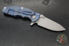 Hinderer Jurassic- Slicer Edge- Hollow Grind- Battle Blue Titanium and Various G-10 Handle Scales- Working Finish Magnacut Steel Blade