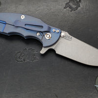 Hinderer Jurassic- Slicer Edge- Hollow Grind- Battle Blue Titanium and Various G-10 Handle Scales- Working Finish Magnacut Steel Blade