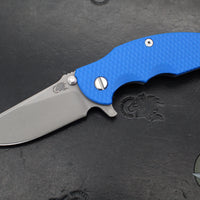 Hinderer Jurassic- Slicer Edge- Hollow Grind- Battle Blue Titanium and Various G-10 Handle Scales- Working Finish Magnacut Steel Blade