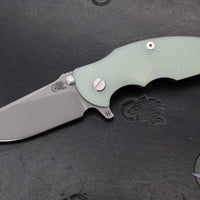 Hinderer Jurassic- Slicer Edge- Hollow Grind- Battle Blue Titanium and Various G-10 Handle Scales- Working Finish Magnacut Steel Blade