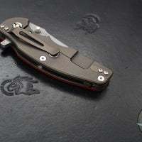 Hinderer Jurassic- Slicer Edge- Hollow Grind- Battle Bronze Titanium and Various G-10 Handle Scales- Working Finish Magnacut Steel Blade