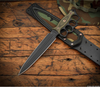 RMJ Lady Death- Knuckle Duster Trench Knife- Graphite Black Finished- Dirty Olive G-10- Woodland Camo And Leather Sheath