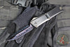 Marfione Custom Combat Troodon- Gen III- Double Edge- Black Deep Engraved Chassis- Blued Bertie Reitveld Dragonskin Ball Bearing Damascus Compound Ground Blade 1142-16 BRBLKBZFL-MCK