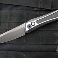 Protech Custom Oligarch Out The Side (OTS) Auto Knife - BLADE SHOW 2025- Blackwash/Satin Flat DLC Two-Tone Stainless Handle With Weave Texture- Smokey Grey DLC Magnacut Blade- Black Lip Pearl Button 2025 Oligarch Custom 003