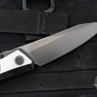 Protech Custom Oligarch Out The Side (OTS) Auto Knife - BLADE SHOW 2025- Blackwash/Satin Flat DLC Two-Tone Stainless Handle With Weave Texture- Smokey Grey DLC Magnacut Blade- Black Lip Pearl Button 2025 Oligarch Custom 003