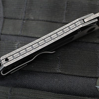 Protech Custom Oligarch Out The Side (OTS) Auto Knife - BLADE SHOW 2025- Blackwash/Satin Flat DLC Two-Tone Stainless Handle With Weave Texture- Smokey Grey DLC Magnacut Blade- Black Lip Pearl Button 2025 Oligarch Custom 003