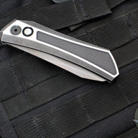 Protech Custom Oligarch Out The Side (OTS) Auto Knife - BLADE SHOW 2025- Blackwash/Satin Flat DLC Two-Tone Stainless Handle With Weave Texture- Smokey Grey DLC Magnacut Blade- Black Lip Pearl Button 2025 Oligarch Custom 003