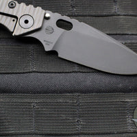 Strider SMF Folder- Drop Point- Black Textured G-10 And Flamed Titanium- Black Finished Magnacut Blade