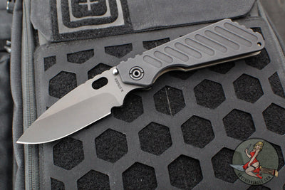 Strider Knives SMF- Drop Point- Shot Show 2025- Veni Vidi Vici- Black Slotted Aluminum And Flamed Ti- Black Magnacut Blade