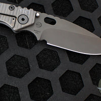 Strider Knives SMF- Drop Point- Shot Show 2025- Veni Vidi Vici- Black Slotted Aluminum And Flamed Ti- Black Magnacut Blade