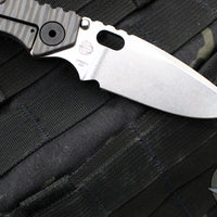 Mick Strider SnG Folder- Drop Point- Black Slotted Aluminum/ Flamed Titanium Handle- Stonewash Finished Blade