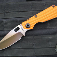 Strider Knives SnG- Drop Point- Special Anodized Titanium Contoured Gunner Grip Scale- Orange G-10 Gunner Grip Scale- Thermal Color Finished Magnacut Blade