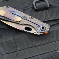 Strider Knives SnG- Drop Point- Special Anodized Titanium Contoured Gunner Grip Scale- Orange G-10 Gunner Grip Scale- Thermal Color Finished Magnacut Blade