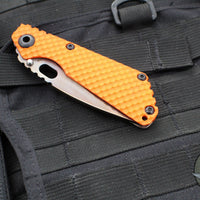 Strider Knives SnG- Drop Point- Special Anodized Titanium Contoured Gunner Grip Scale- Orange G-10 Gunner Grip Scale- Thermal Color Finished Magnacut Blade