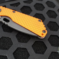 Mick Strider SnG Folder- Tanto Edge- Orange Gunner Grip G-10- Stonewash Gunner Grip Titanium- Black Magnacut Steel Blade