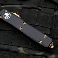 Microtech Ultratech OTF Knife- Single Edge- Black Handle- Bronzed Part Serrated Blade 121-14