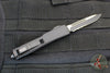 Microtech UTX-70 OTF Knife- Single Edge- Tactical- Black Handle- Black Part Serrated Blade 148-2 T