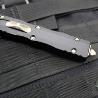 Microtech Dirac OTF Knife- Double Edge- Black with Bronzed Part Serrated Blade HW 225-14