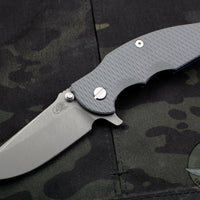 Hinderer Jurassic Spearpoint Grey G-10 3.375" Battle Blue Titanium and Working Finish Blade Gen 6 Tri-Way Pivot System